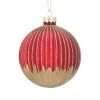 A red ribbed glass Christmas bauble with gold glitter
