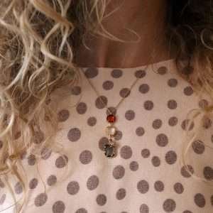 Fine golden chain necklace with smoky grey, bronze and clear square glass crystals in faux gold claw settings. Each crystal is linked together and a little faux gold plated crystal inset star charm