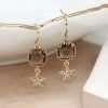 Faux gold plated drop earrings with smoky bronze coloured square crystals in golden claw settings and little star drops inset with clear crystals.