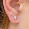 Sterling silver starburst stud earrings with cubic zirconia