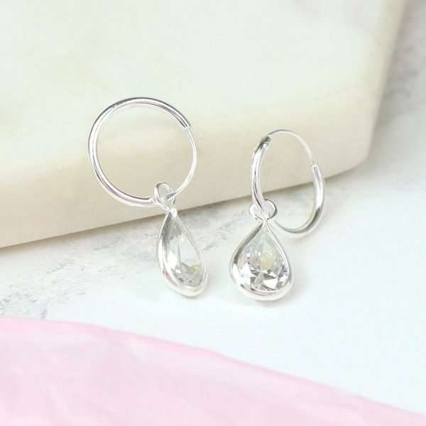 Sterling silver sleeper hoop earrings with faceted CZ crystal teardrops in silver settings