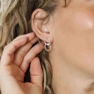 Sterling silver stud earrings with a double linked hoop design and subtle hammered surface