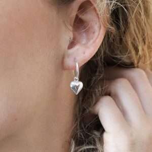 Sterling silver half hoop stud earrings with a puff heart charm on each