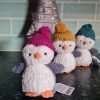 A little Jellycat penguin in a wooly bobble hat