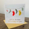 Merry Christmas and a Happy New Year Card with stockings and gold foil details