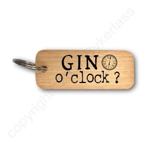 A wooden key ring with Gin O'Clock