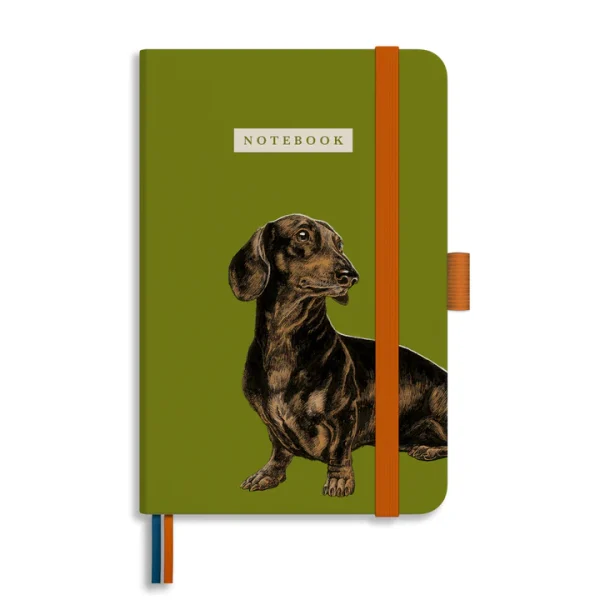 A hard cover notebook witha a dachshund on the cover