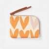 A sweet coin purse with an orange heart design