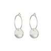 White porcelain disks dipped in silver suspended from silver earring hoops