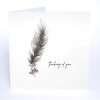 A thinking of you card with a hand painted feather