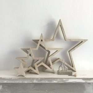 A set of four hanging natural outline hanging wooden stars in 4 different sizes