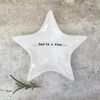 A star shaped white porcelain trinket dish with you're a star written on the bottom