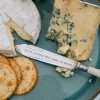An antique bone handled knife hand stamped with SWEET DREAMS ARE MADE OF CHEESE! A hand stamped cheese knife