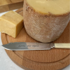 An antique bone handled knife hand stamped with STRONG AND STINKY! A hand stamped cheese knife