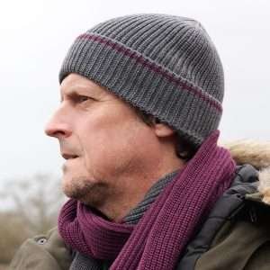 A lovely grey ribbed beanie knit hat with a burgundy trim.