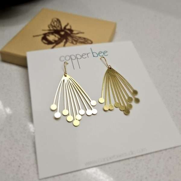 Large seed head motifs in brass on gold plated hooks