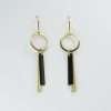 handmade earrings with 2 brass bars one black oxidised brass hanging from a brass circle