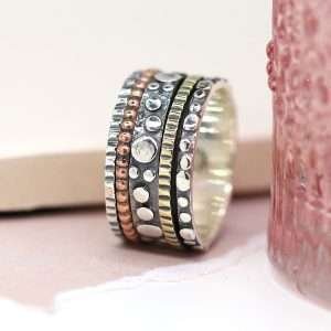 Sterling silver brass and copper spinning ring in a bubble design