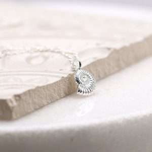 Sterling silver rounded pebble heart drop earrings with a smooth polished surface on fine silver earring hooks.