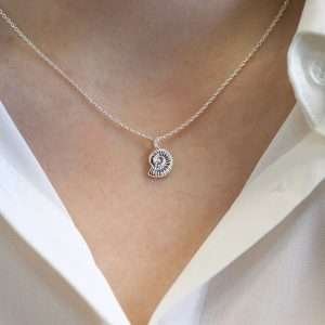 Sterling silver rounded pebble heart drop earrings with a smooth polished surface on fine silver earring hooks.