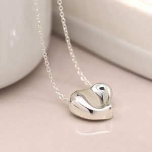 Silver plated fine chain necklace with a heart pendant featuring a gentle wave surface and polished finish