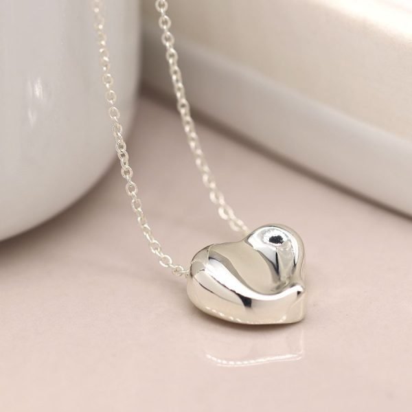 Silver plated fine chain necklace with a heart pendant featuring a gentle wave surface and polished finish