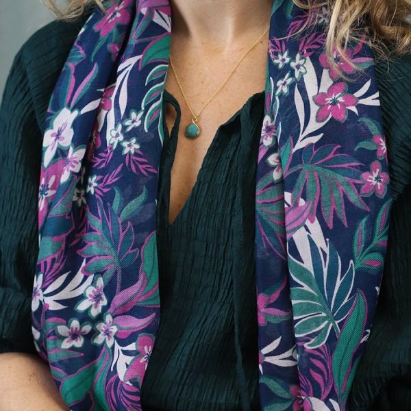 a teal and purple tropical vine and floral print scarf