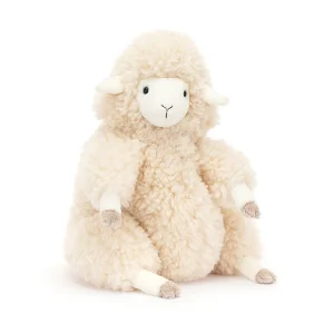 A fluffy cream sheep cuddly toy from Jellycat. sitting down with a curly fluffy coat and a cream cute face