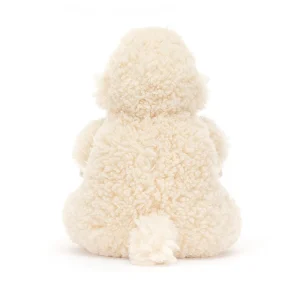 A fluffy cream sheep cuddly toy from Jellycat. sitting down with a curly fluffy coat and a cream cute face