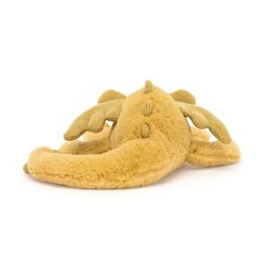 A golden coloured cuddly dragon from Jellycat. In a laying down position with a cute face sparkly wings and a long furry tail