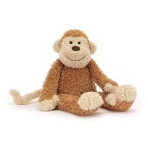 A monkey soft toy from Jellycat with a toffee brown body and pale peach face, hands, feet and tail and a cute face
