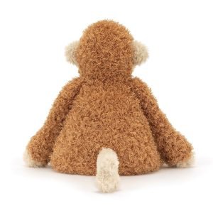 A monkey soft toy from Jellycat with a toffee brown body and pale peach face, hands, feet and tail and a cute face