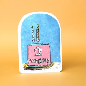 A birthday card with a pink cake on a blue background. there are 2 candles on the cake and 2 today on the front of the cake