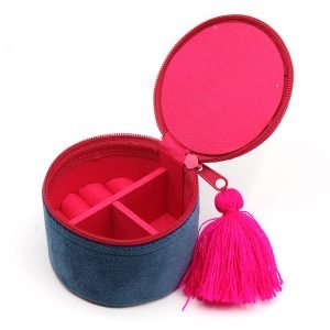 Round velvet trinket box in rich teal with floral embroidery and zip top with tassel