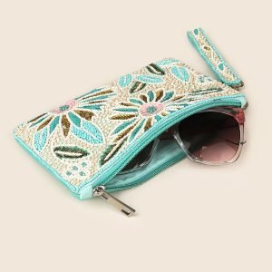 Turquoise floral zip purse with beaded embellishments in turquoise, white, pale pink and gold and a matching wrist strap
