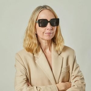 Model wearing Square lens sunglasses with smokey grey frame