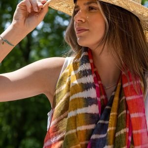 Organic cotton scarf in a mix of red, pink and olive with batik stripes