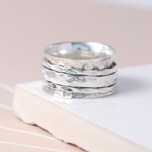 Hand crafted spinning ring made from fine quality beaten sterling silver with three moving bands