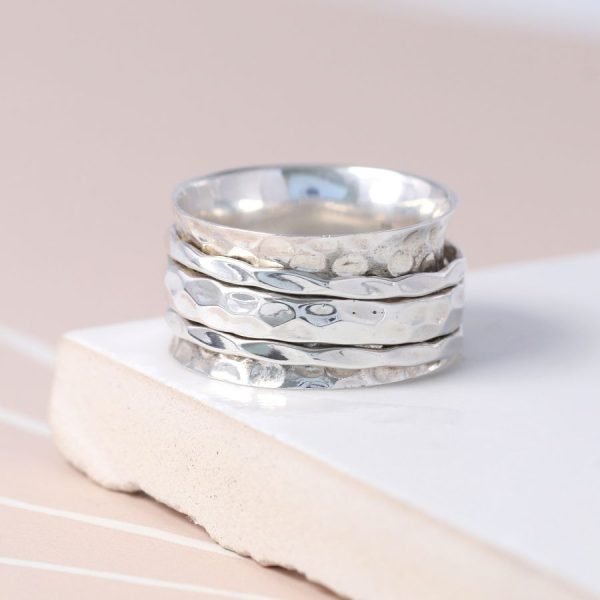 Hand crafted spinning ring made from fine quality beaten sterling silver with three moving bands
