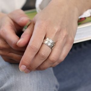 Hand crafted spinning ring made from fine quality beaten sterling silver with three moving bands