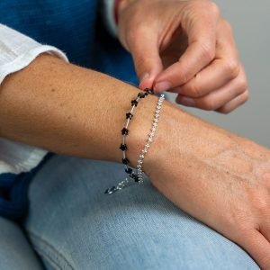 Silver plated layered bracelet with bead chain and black stars, fastened with a silver plated lobster clasp and extension chain