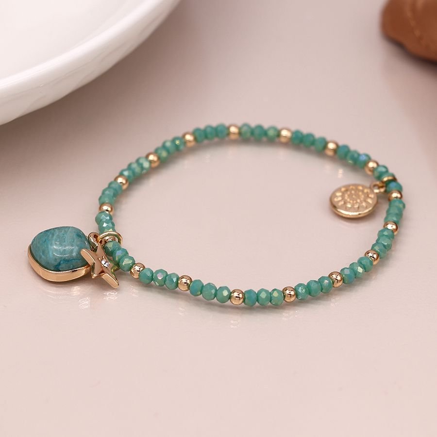 Aqua and rose gold style bead bracelet with aqua stone and rose gold style crystal inset star charm