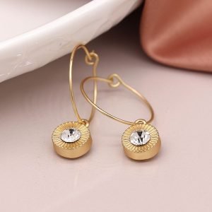 Faux gold plated wire hoop earrings with embossed disc drops and crystal inset
