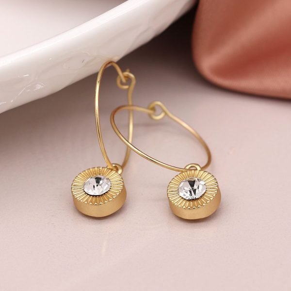Faux gold plated wire hoop earrings with embossed disc drops and crystal inset