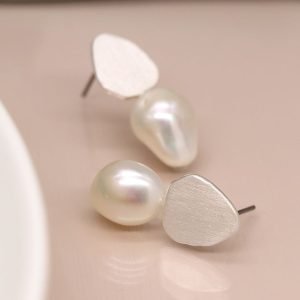 Silver plated organic teardrop shaped stud earring with a brushed finish and ivory freshwater pearls