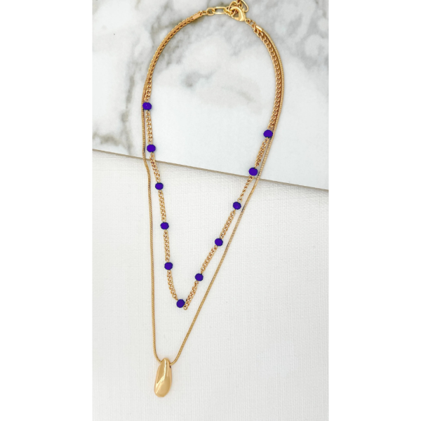 Short gold necklace with blue crystals