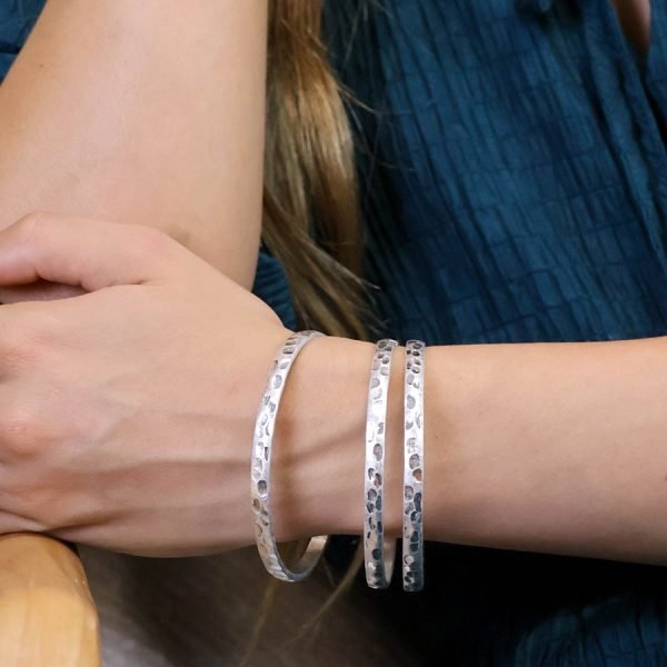 Worn silver plated triple bangle set