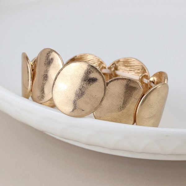 Golden worn disc stretch bracelet