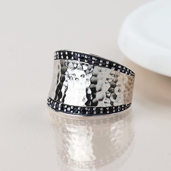Sterling silver beaten ring with stone border